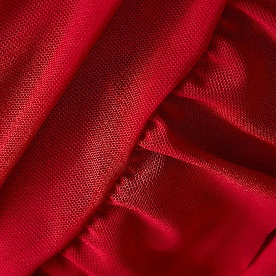 Close-up of red fabric with a textured pattern