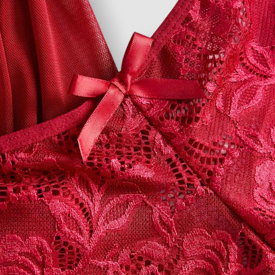 Close-up of a red lace fabric with a bow