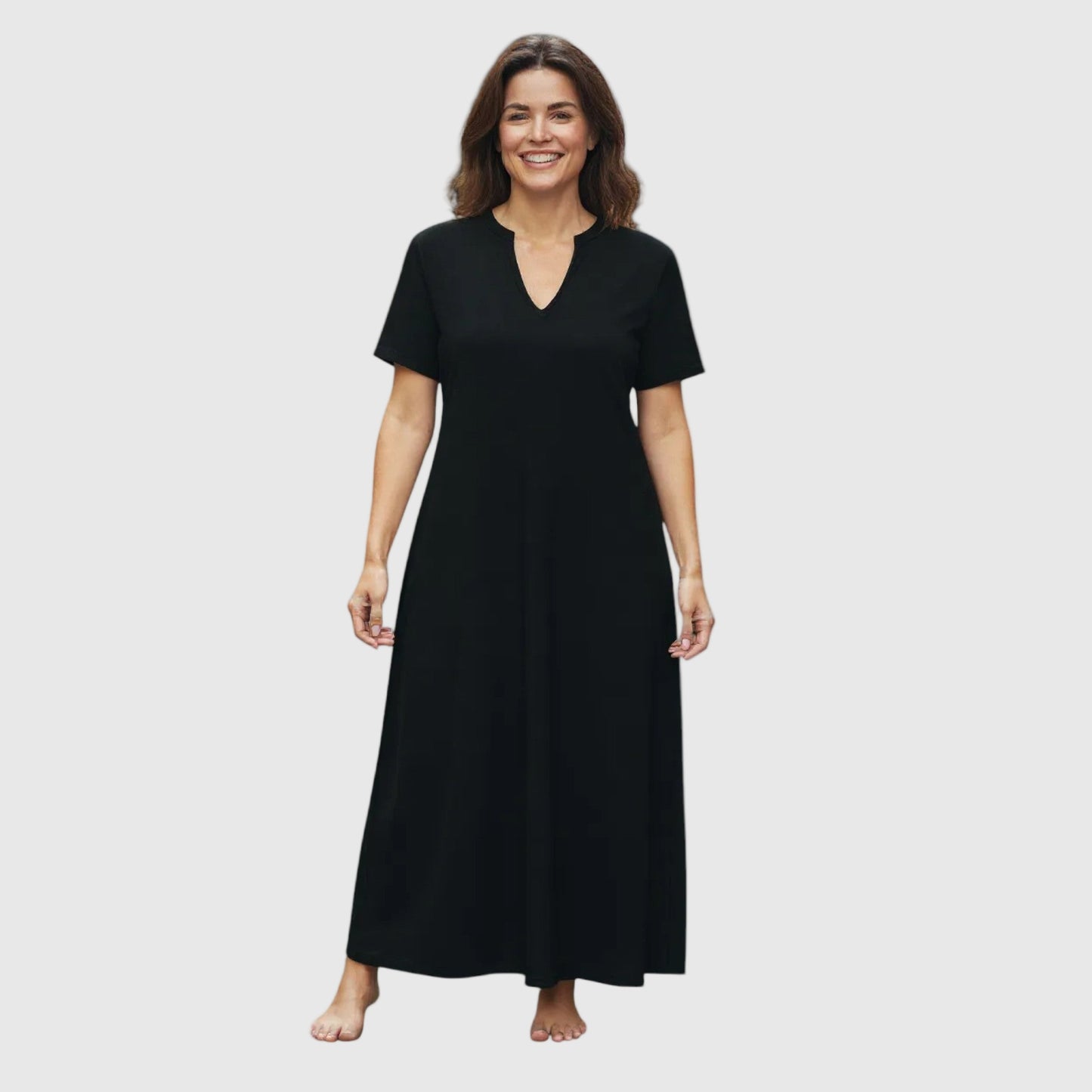 Woman wearing a dark blue dress on a white background