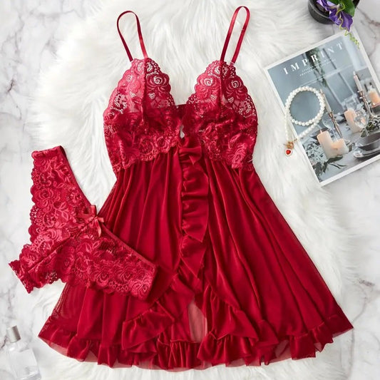 Red lace lingerie set front on a white surface with a magazine and jewelry