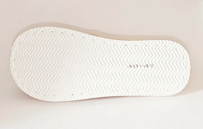 Elegante pantufla de mujer con lazo