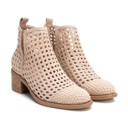 Pair of beige perforated ankle boots TXI on a white background
